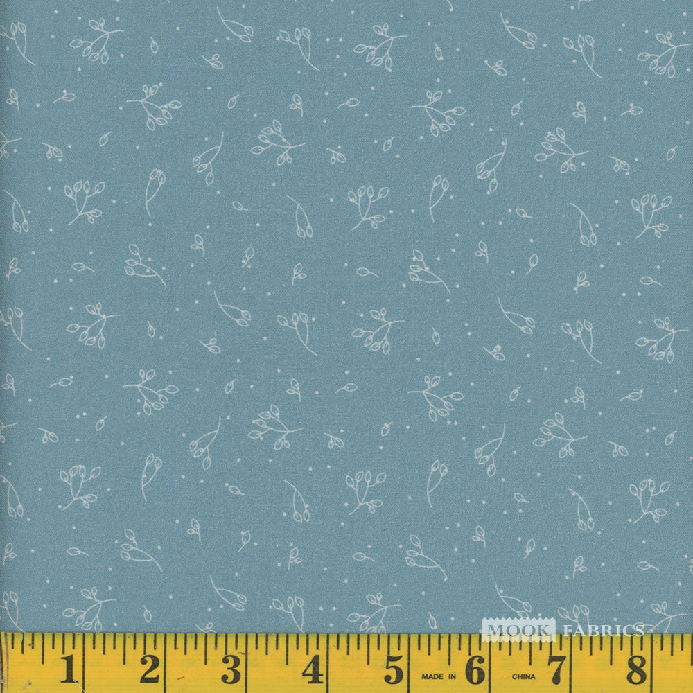 Fabric with subtle floral pattern on an aqua blue background, measured by a yellow ruler at the bottom.