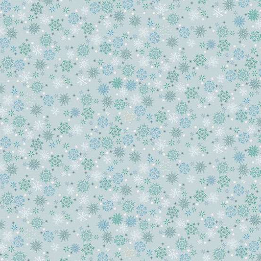 Pattern of snowflakes on a light blue background