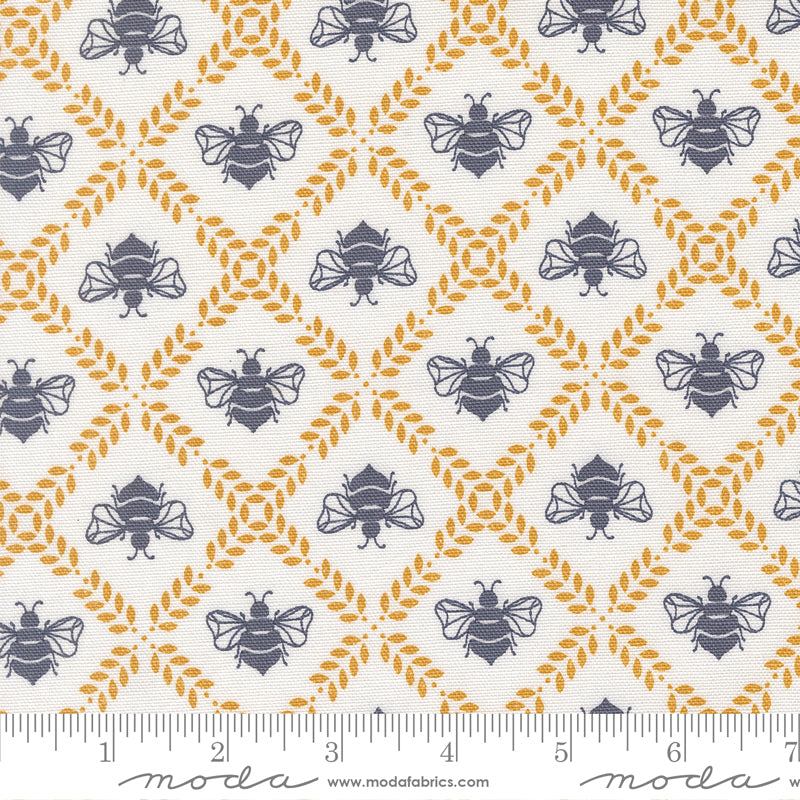 Patterned fabric with bees and geometric shapes, featuring Moda label at the bottom.