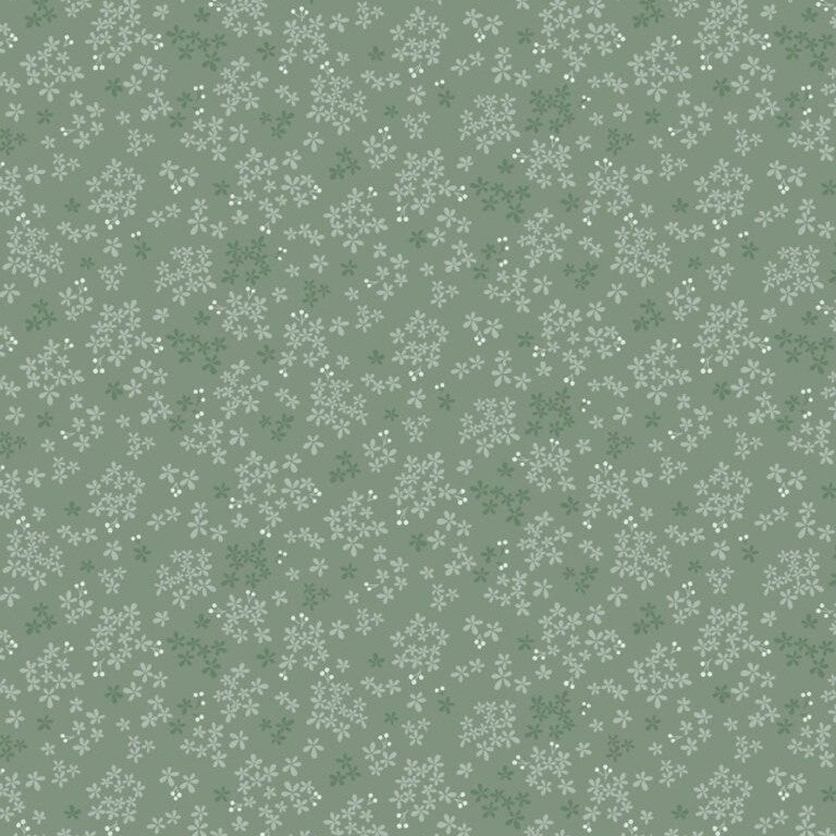 Pattern of small white flowers on a green background