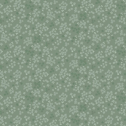 Pattern of small white flowers on a green background