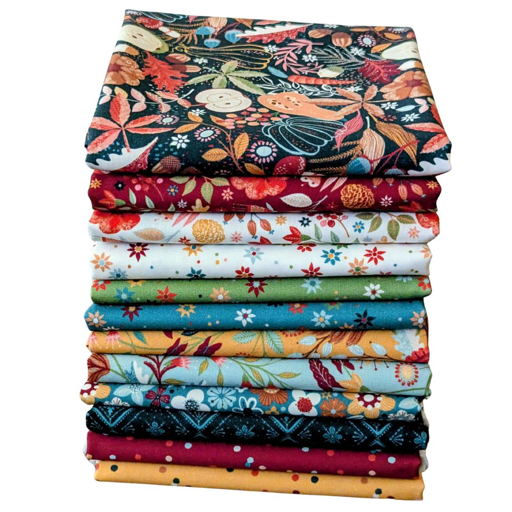 Stack of fabric in rich fall colours.