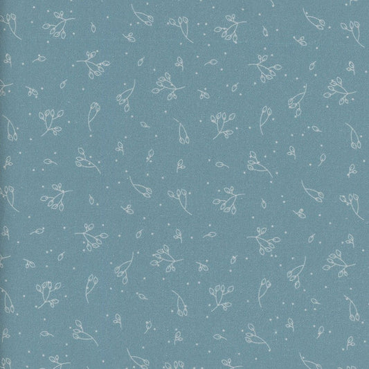 Patterned fabric with small white floral designs on an aqua blue background