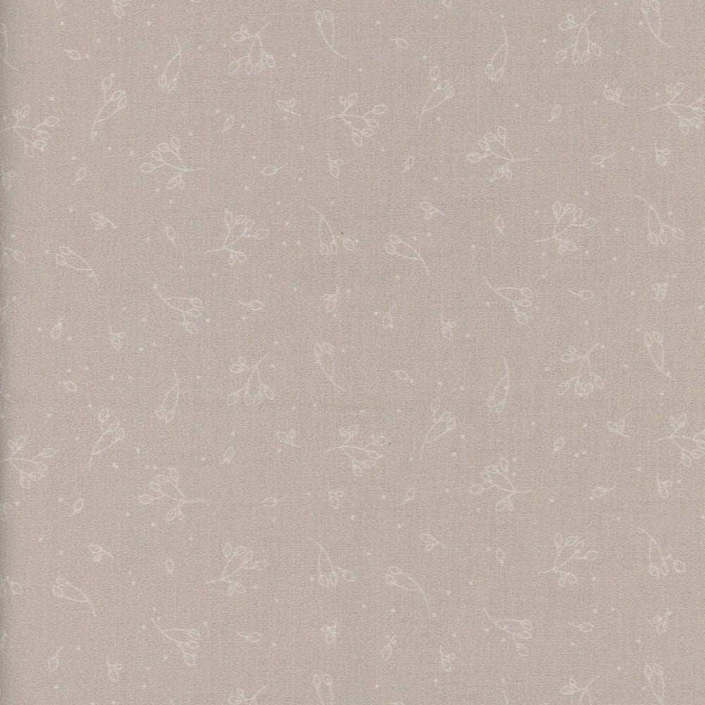 Patterned wallpaper with small floral designs on a light beige background