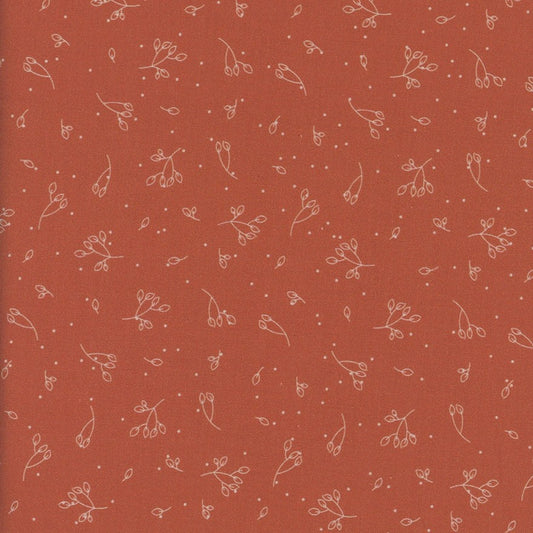 Dark orange fabric with small white floral pattern