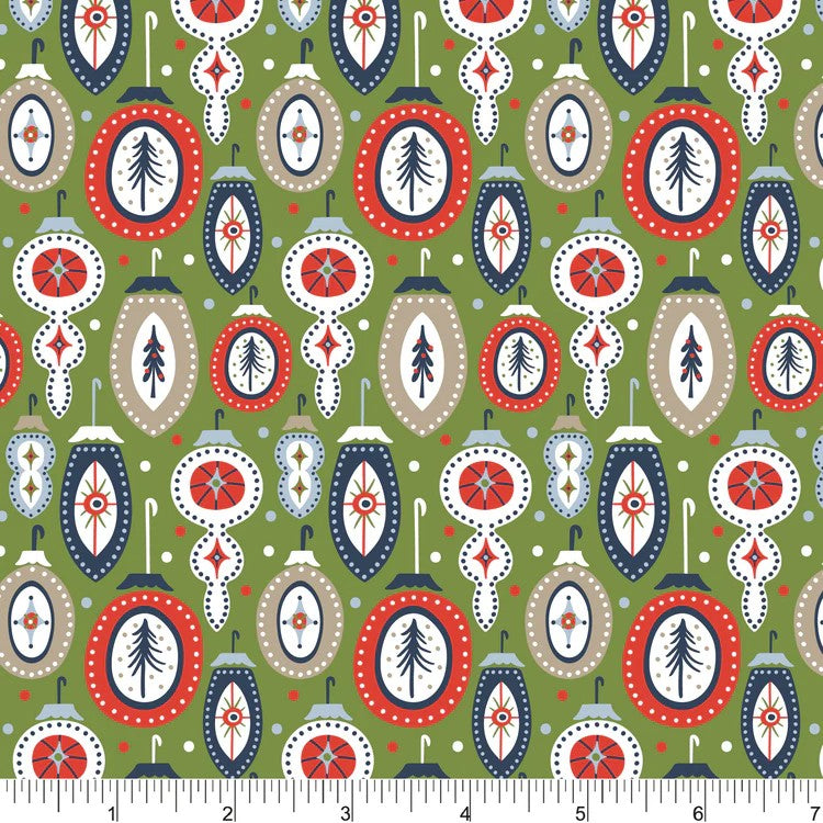 A repeating holiday ornament pattern on an olive green background, featuring red, navy, beige, and white ornaments with tree motifs. A white ruler strip appears along the bottom edge for scale.