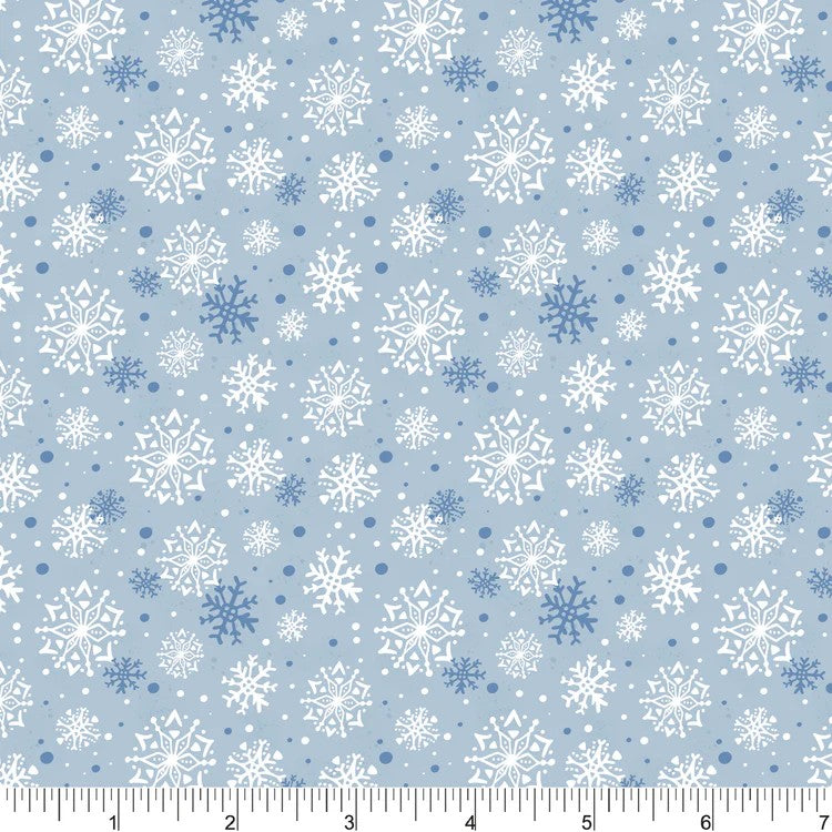 Light blue fabric with a repeating snowflake pattern in white and medium blue, shown with a 6-inch fabric ruler along the bottom edge.
