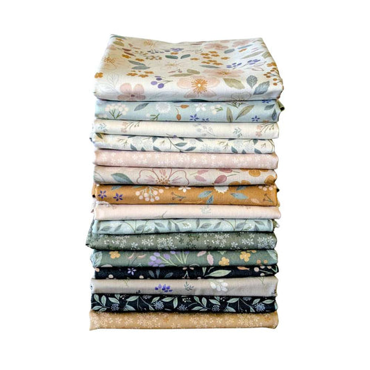 Stack of floral fabric sheets on a white background