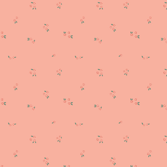 A seamless repeating pattern of small pink and red cherry blossoms with green leaves on a solid peach-pink background.